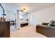 Spacious bedroom features a canopy bed with a decorative ceiling fan at 1912 Maury Rd, St Cloud, FL 34771