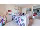 bedroom featuring unicorn themed decor, plush carpet, and a television at 1912 Maury Rd, St Cloud, FL 34771