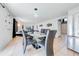 Contemporary dining area connects the kitchen and living space with seamless transition at 1912 Maury Rd, St Cloud, FL 34771