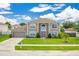 Charming two-story home featuring neutral exterior, manicured lawn, and an attached two-car garage at 1912 Maury Rd, St Cloud, FL 34771