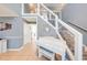 Elegant foyer with staircase featuring wood-look treads and glass-paneled railings at 1912 Maury Rd, St Cloud, FL 34771