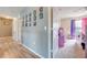 Upstairs hallway featuring access to bedrooms and wooden floors at 1912 Maury Rd, St Cloud, FL 34771