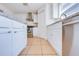 Kitchen showcasing white cabinets, stainless steel appliances, granite countertops, and ample storage space at 1912 Maury Rd, St Cloud, FL 34771