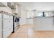 A functional kitchen with stainless steel appliances, white cabinetry, granite counters, and tile flooring at 1912 Maury Rd, St Cloud, FL 34771