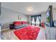 Living room with gray walls, wood-look floors, and entertainment center at 1912 Maury Rd, St Cloud, FL 34771