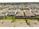 Aerial neighborhood view showing modern home construction and manicured lawns in a planned community at 19267 Allium Pl, Orlando, FL 32827