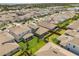Community view of the neighborhood showing a variety of single-Gathering homes and the surrounding landscape at 19267 Allium Pl, Orlando, FL 32827