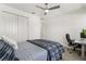 Inviting bedroom featuring a bed, closet, and desk for work or study at 19267 Allium Pl, Orlando, FL 32827