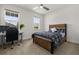 Serene bedroom with a bed, two windows, desk, and comfortable office chair at 19267 Allium Pl, Orlando, FL 32827