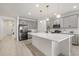 View of the kitchen featuring stainless steel appliances, white countertops, and gray cabinets at 19267 Allium Pl, Orlando, FL 32827