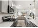 View of the kitchen featuring white countertops, stainless steel appliances, and hardwood floors at 19267 Allium Pl, Orlando, FL 32827