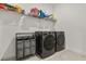 Convenient laundry room with modern washer and dryer, and ample storage space at 19267 Allium Pl, Orlando, FL 32827