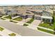 Neighborhood street view showcasing the modern architecture of single-Gathering homes and neat landscaping at 19267 Allium Pl, Orlando, FL 32827