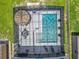 Aerial view of a screened pool, tiki bar, and seating area at 209 Willow Bend Dr, Davenport, FL 33897