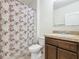 Cozy bathroom featuring a shower-tub combo and a granite countertop vanity at 209 Willow Bend Dr, Davenport, FL 33897