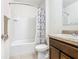 Cozy bathroom featuring a shower-tub combo and a granite countertop vanity at 209 Willow Bend Dr, Davenport, FL 33897