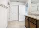 Bathroom with granite countertop vanity and multiple access doors at 209 Willow Bend Dr, Davenport, FL 33897