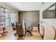 Bright dining room featuring modern table, stylish chairs, and contemporary sideboard with decor at 209 Willow Bend Dr, Davenport, FL 33897