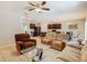 Open-concept living space blending living room, kitchen, and dining for seamless entertaining at 209 Willow Bend Dr, Davenport, FL 33897