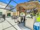 Outdoor area features a pool, outdoor kitchen, seating, and provides an amazing area for dining and recreation at 209 Willow Bend Dr, Davenport, FL 33897