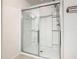 Bright shower with sliding glass doors and an adjustable shower head at 209 Willow Bend Dr, Davenport, FL 33897