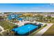 Panoramic aerial view highlighting the community's pool, basketball and volleyball courts, and residential area at 2161 Lelani Cir, Davenport, FL 33897