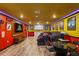 Finished basement with a custom bar, dining area, and entertainment area featuring a movie screen and ambient lighting at 2161 Lelani Cir, Davenport, FL 33897