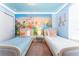 Charming bedroom featuring twin beds and princess wall mural at 2161 Lelani Cir, Davenport, FL 33897