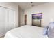 Comfortable bedroom with a spacious closet, a TV, and a calming view, creating a relaxing retreat at 2161 Lelani Cir, Davenport, FL 33897