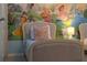 Close up view of a Charming bedroom featuring twin beds and princess wall mural at 2161 Lelani Cir, Davenport, FL 33897