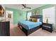 Bedroom featuring a comfortable bed, stylish decor, and bedside tables with lamps, creating a relaxing and inviting space at 2161 Lelani Cir, Davenport, FL 33897