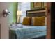 Cozy bedroom featuring a comfortable bed with decorative pillows and a bedside lamp, perfect for relaxation at 2161 Lelani Cir, Davenport, FL 33897
