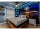 Themed bedroom with spaceship wall art, custom headboard and unique lighting at 2161 Lelani Cir, Davenport, FL 33897