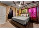 Unique Harry Potter themed bedroom with detailed wall decor, comfortable bed, and themed accents for an immersive experience at 2161 Lelani Cir, Davenport, FL 33897