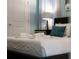 Stylish bedroom with soft lighting, featuring a well-made bed, decorative pillows, and modern decor at 2161 Lelani Cir, Davenport, FL 33897