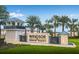 Windsor Island Resort's grand entrance showcases beautiful landscaping, water features and resort amenities at 2161 Lelani Cir, Davenport, FL 33897