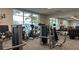 State-of-the-art fitness center with modern equipment and scenic views of the outdoor pool area at 2161 Lelani Cir, Davenport, FL 33897