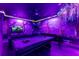 Game room featuring murals, a pool table, foosball table, seating, and custom lighting for an immersive experience at 2161 Lelani Cir, Davenport, FL 33897