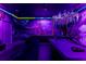 Unique game room with murals, lighting, a pool table, foosball table, and comfortable seating for endless entertainment at 2161 Lelani Cir, Davenport, FL 33897