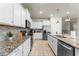 Contemporary kitchen with granite countertops, stainless steel appliances, and tile backsplash at 2161 Lelani Cir, Davenport, FL 33897