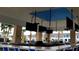 Stylish outdoor bar with multiple TVs, ample seating, and a great view of the surrounding community at 2161 Lelani Cir, Davenport, FL 33897