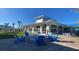 Inviting outdoor area with a fire pit, comfortable seating, and lush landscaping, ideal for socializing and relaxation at 2161 Lelani Cir, Davenport, FL 33897