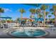 Relax in the community's inviting pool area featuring comfortable seating, umbrellas, and a spa at 2161 Lelani Cir, Davenport, FL 33897