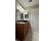 Bathroom vanity with granite countertops, vessel sink and modern lighting for a spa-like feel at 2326 St Marteen Ct, Kissimmee, FL 34741