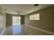 Spacious bedroom with tile flooring, ceiling fan, and sliding glass doors at 2326 St Marteen Ct, Kissimmee, FL 34741