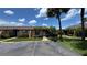 Charming single-story home with a well-maintained lawn and mature palm trees at 2326 St Marteen Ct, Kissimmee, FL 34741