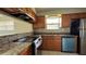 Modern kitchen with updated countertops, stainless steel appliances, and warm-toned cabinetry at 2326 St Marteen Ct, Kissimmee, FL 34741