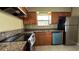 Functional kitchen featuring updated countertops, stainless steel appliances, and ample cabinet space at 2326 St Marteen Ct, Kissimmee, FL 34741