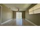 Bright living room features tile flooring and sliding glass doors to the backyard at 2326 St Marteen Ct, Kissimmee, FL 34741