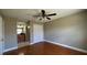 Bedroom with view into bathroom featuring a vanity and walk-in closet at 2326 St Marteen Ct, Kissimmee, FL 34741